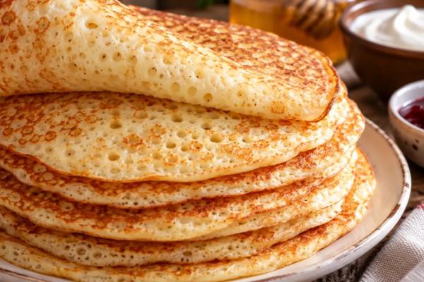 Блины как у бабушки из печки: пышные, румяные и с сотней дырочек - секрет в одной крупе